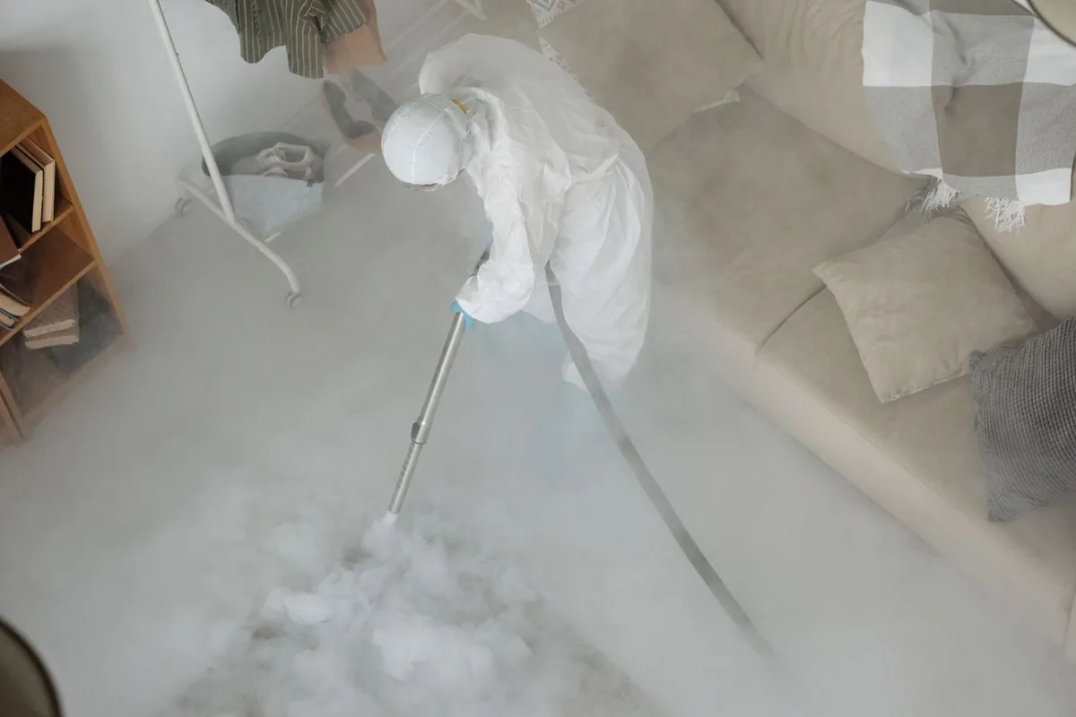 Biohazard cleanup technician in protective equipment, Bolivar, TN